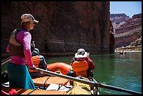 On raft passing below redwall limestone cliff. Grand Canyon National Park, Arizona