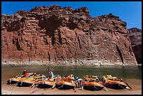 Rafts moored opposite redwall limestone cliff. Grand Canyon National Park, Arizona