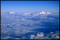 Summit of Mt Foraker and Mt Mc Kinley emerging from  clouds. Denali National Park, Alaska, USA. (color)