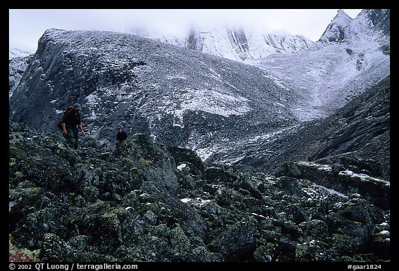 Backpackers on boulder fields in Aquarius Valley. Gates of the Arctic National Park, Alaska
