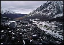 Boulders, valleys and slopes with fresh snow in cloudy weather. Gates of the Arctic National Park ( color)