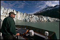 Captain guiding boat near Lamplugh glacier. Glacier Bay National Park ( color)