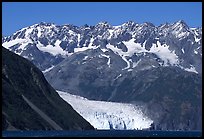 Aialik Glacier, fjord,  and steep mountains. Kenai Fjords National Park, Alaska, USA.