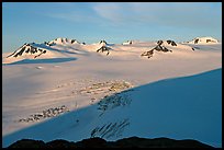 Snow-covered glacier and Harding Ice field peaks, sunrise. Kenai Fjords National Park, Alaska, USA.