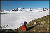 Tent and backpacker above the Harding icefield. Kenai Fjords National Park, Alaska, USA. (color)