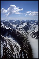 Aerial view of rocky peaks with snow, Chigmit Mountains. Lake Clark National Park, Alaska, USA. (color)