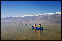 Canoe near the dragon in Manly Lake, below the Panamint Range. Death Valley National Park, California, USA.