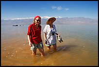Women wading in the knee-deep seasonal lake. Death Valley National Park ( color)