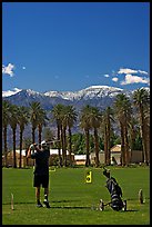 Golfer in Furnace Creek Golf course. Death Valley National Park, California, USA. (color)