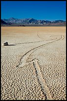 Zig-zagging track and sailing stone, the Racetrack playa. Death Valley National Park, California, USA. (color)