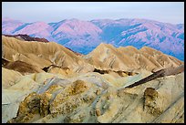 Badlands and mountains at sunrise, Twenty Mule Team Canyon. Death Valley National Park ( color)