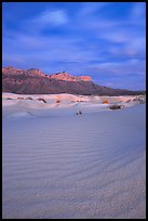 Gypsum sand dunes and Guadalupe range at sunset. Guadalupe Mountains National Park, Texas, USA.