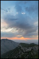 Dark clouds at sunrise over mountains. Guadalupe Mountains National Park, Texas, USA. (color)