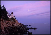 Bass Harbor lighthouse on rocky coast, sunset. Acadia National Park, Maine, USA.