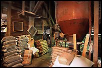 Grain distributor and bags of seeds in Wilson Mill. Cuyahoga Valley National Park, Ohio, USA.