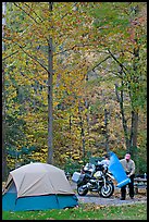 Tent and motorcycle camper under trees in fall colors. Hot Springs National Park, Arkansas, USA. (color)