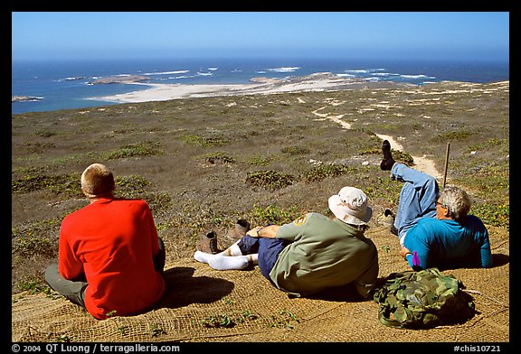 Hikers observing Point Bennett from a distance, San Miguel Island. Channel Islands National Park (color)