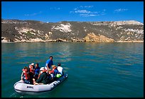 Campers using a skiff to land, San Miguel Island. Channel Islands National Park, California, USA. (color)