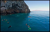 Divers, emerald waters, and steep cliffs, Annacapa island. Channel Islands National Park, California, USA. (color)