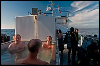 Soaking in hot tub on diving boat, Annacapa Island. Channel Islands National Park, California, USA. (color)