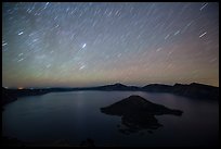 Star trails over Crater Lake and Wizard Island. Crater Lake National Park, Oregon, USA.