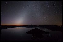 Glow from dawn and starry sky. Crater Lake National Park, Oregon, USA.