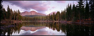 Volcanic peak and conifer reflected in lake. Lassen Volcanic National Park (Panoramic color)
