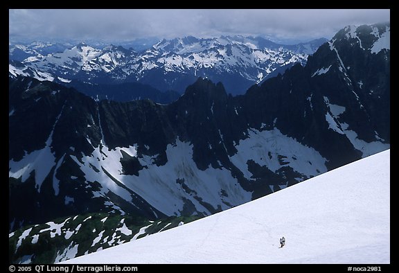 Mountain ridges, and mountaineers on snow field, North Cascades National Park.  (color)
