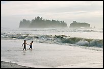 Children playing in water in front of sea stacks, Rialto Beach. Olympic National Park ( color)