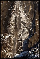 Upper Yosemite Falls and icy rock wall. Yosemite National Park, California, USA.