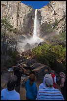 Tourists standing below Bridalvail Fall. Yosemite National Park, California, USA. (color)