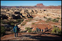 Group hiking down into the Maze. Canyonlands National Park, Utah, USA. (color)