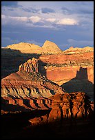 Cliffs and domes in the Waterpocket Fold, clearing storm, sunset. Capitol Reef National Park, Utah, USA.