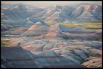 Delicately colored badlands and prairie at sunrise. Badlands National Park, South Dakota, USA. (color)