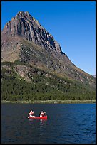 Red canoe on Swiftcurrent Lake. Glacier National Park, Montana, USA.