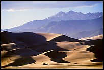Distant view of dunes and Sangre de Christo mountains in late afternoon. Great Sand Dunes National Park, Colorado, USA. (color)