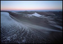 Sparse snow on the dunes at dawn. Great Sand Dunes National Park and Preserve, Colorado, USA.