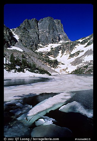 Ice break-up in Emerald Lake and Hallet Peak, early summer. Rocky Mountain National Park (color)