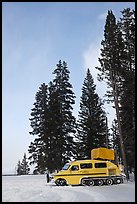 Snowcoach and trees. Yellowstone National Park, Wyoming, USA. (color)