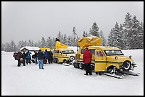 Winter tour snow coaches unloading, Flagg Ranch. Yellowstone National Park, Wyoming, USA. (color)