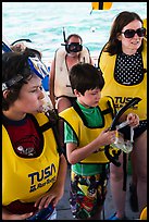 Family preparing for snorkeling. Biscayne National Park, Florida, USA. (color)
