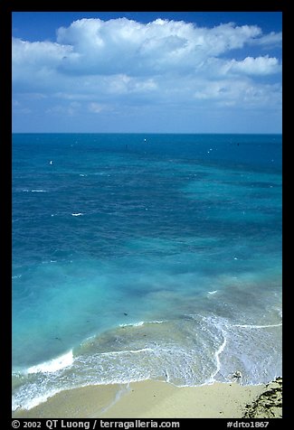 Open ocean view with beach, turquoise waters and surf. Dry Tortugas National Park, Florida, USA.