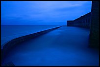 Seawall at dusk during  storm. Dry Tortugas National Park, Florida, USA. (color)