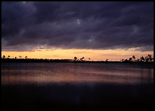 Sunset with dark clouds,  Pine Glades Lake. Everglades National Park, Florida, USA.