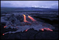Molten lava flow at dawn on coastal plain. Hawaii Volcanoes National Park, Hawaii, USA.