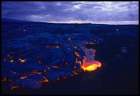 Red lava glows at dawn. Hawaii Volcanoes National Park, Hawaii, USA. (color)