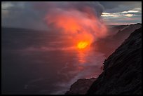Coastline with steam lit by hot lava. Hawaii Volcanoes National Park, Hawaii, USA. (color)