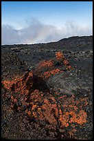 Red and orange lava, rainbow in clouds, Mauna Loa. Hawaii Volcanoes National Park, Hawaii, USA. (color)