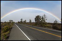 Rainbow over highway. Hawaii Volcanoes National Park, Hawaii, USA. (color)