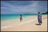 Two women, the Older in hawaiian dress, on Waimanalo Beach. Oahu island, Hawaii, USA (color)